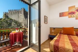 Gulta vai gultas numurā naktsmītnē Hotel Antica Croce - Gardaslowemotion