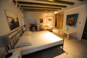 a bedroom with a bed and a living room at Villa St Vitus in Dubrovnik