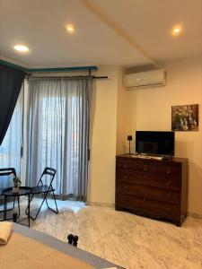 TV a/nebo společenská místnost v ubytování Domus Antica Trastevere