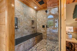 a bathroom with a shower with a glass door at 1 Great Mountain View by American Patriot Getaways in Park Settlement +76 photos