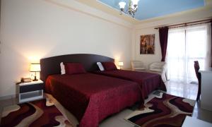 Postel nebo postele na pokoji v ubytování Orchidea Hotel