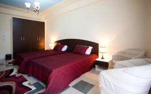 Postel nebo postele na pokoji v ubytování Orchidea Hotel