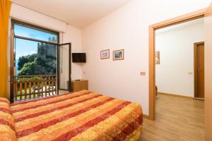 Gulta vai gultas numurā naktsmītnē Hotel Antica Croce - Gardaslowemotion