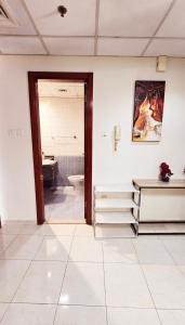 a bathroom with a sink and a toilet at Dragon Golden Apartment in Dubai