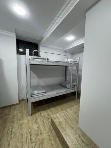 a room with two bunk beds in a room at Ava Hostel Yerevan in Yerevan +7 photos