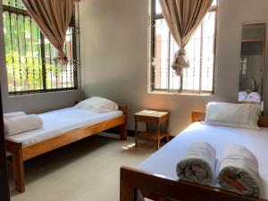 Katil atau katil-katil dalam bilik di Moshi Green Lodge