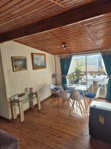 a dining room with a table and chairs at Casas Pamelas in Algarrobo