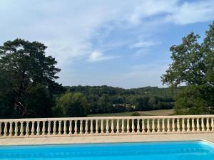 a view from the top of a house with a white railing at Chateau De La Ricardie, Gite La Ricardie, Beautiful Rural Property Gite Villa in Liorac