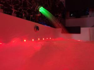 a stage with red and green lights on a ramp at Cozy Calming Apartment in Poznań