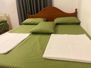 Ένα ή περισσότερα κρεβάτια σε δωμάτιο στο Mogan's Guest House +11 φωτογραφίες