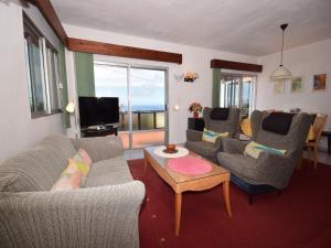 a living room with couches and a coffee table at Holiday Home Mesa del Mar near Black Beach in Tacoronte +32 photos