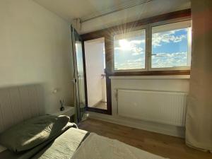 a bedroom with a window and a bed in it at Eiffel Tower View & Pool in Paris +14 photos