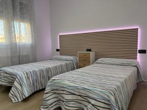 En eller flere senge i et værelse på El Paraíso Del Rey + 55 billeder