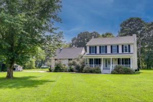 a white house with a large yard at Brand-New Pool! Waterfront Bozman Village Home 