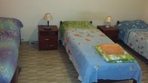 A bed or beds in a room at Hospedaria - Hostel Gamboa