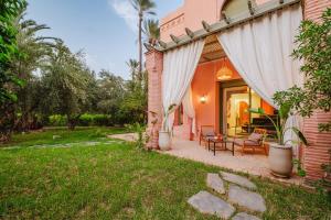 Aed väljaspool majutusasutust Palmeraie, Jardin et Piscine