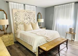 a bedroom with a large bed and a window at Blue Cypress in Cocoa