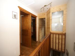 a hallway of a house with wooden walls and wooden floors at Chalet in Ventron near Ski Lift in Ventron