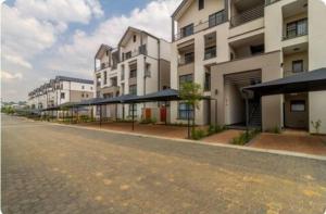 an empty street in front of some buildings at #AlimamaSpaces Pano's Munyaka in Vosburg