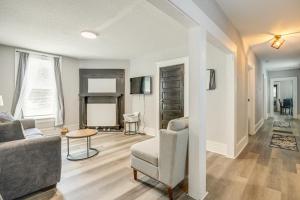a living room with a couch and a chair at Less Than 1 Mi to EverBank Stadium Retreat with Yard! in Jacksonville