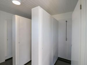 a closet with white cabinets and a ceiling at Bluebell Lodge in Battle