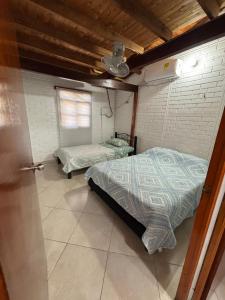 Postel nebo postele na pokoji v ubytování Casa Refugio natural