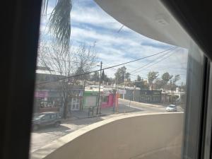 a view of a city street from a window at Departamento in Alta Gracia