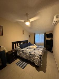 a bedroom with a bed in a room with a ceiling at Casa Condo Diamante, Nueva Vallarta in Nuevo Vallarta 