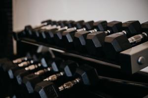 a row of old dumbbells in a gym at Delta Hotels by Marriott Saguenay Conference Centre in Saguenay