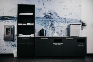 a counter in a room with a wall with a picture at Delta Hotels by Marriott Saguenay Conference Centre in Saguenay +51 photos