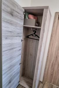 a wooden door in a room with a wall at Apartmán Kovadlina 5 - Kovářov, výhled na Lipno in Frymburk