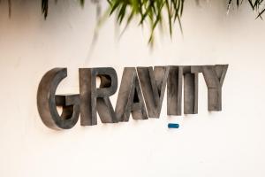 a sign for a gym on a wall at Gravity Eco Boutique Hotel - Adults Only in Uluwatu