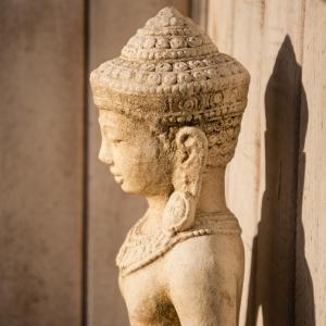 a statue of a woman standing next to a wall at Gravity Eco Boutique Hotel - Adults Only in Uluwatu