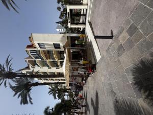 an overhead view of a building with palm trees at Joy and Friends 2 El Carmen in Los Cristianos