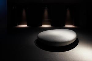 a white chair in a dark room with lights at remm Shin-Osaka in Osaka +33 photos