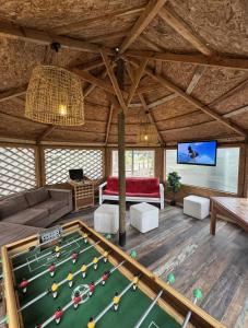 a living room with a pool table in it at Lodge Las Luces de Algarrobo in Algarrobo