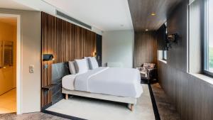 Postel nebo postele na pokoji v ubytování Golden Tulip Amnéville - Hôtel Spa & Casino