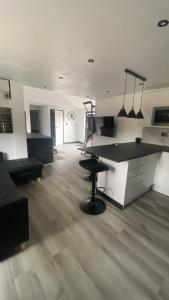 a large room with a desk and a table at The Sauna House in Stockbury +18 photos
