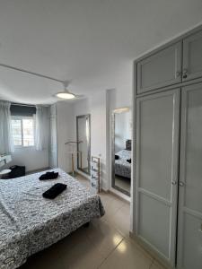 a bedroom with a bed and a large closet at Tagora del Guayero in Los Cristianos +41 photos