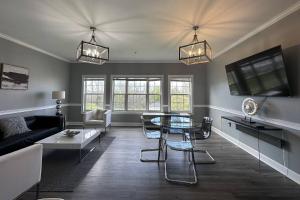 a living room with a couch and a table at Now and Zen in Charlotte
