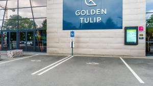 an empty parking lot in front of a building at Golden Tulip Amnéville - Hôtel Spa & Casino in Amnéville +76 photos
