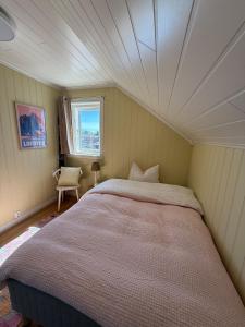 a bedroom with a large bed in a room at Unique Seaside home in Charming Kabelvåg - Lofoten in Kabelvåg