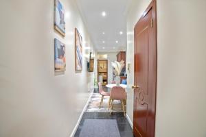 a hallway with a dining room and a table at Relaxed 2BR in Manhattan Valley in New York