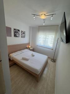 Televiisor ja/või meelelahutuskeskus majutusasutuses For a Stay Aqua