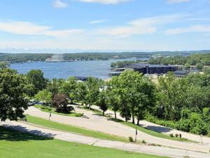 a view of a river with trees and buildings at Avila Serenity Suites - For 6 in Lake Ozark