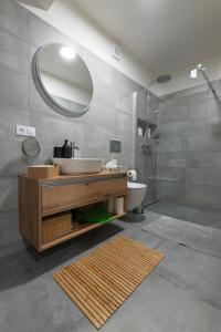 a bathroom with a sink and a mirror at Elements Chopok in Bystrá +34 photos