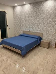 Ένα ή περισσότερα κρεβάτια σε δωμάτιο στο Appartamento Santa House