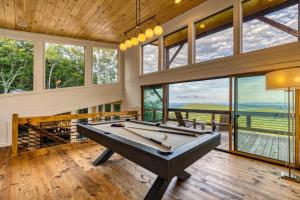 a large room with a pool table and windows at Big Sky - Best Views in Blue Ridge in Epworth