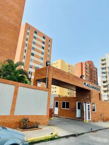a brick building with a sign on it in a city at Centrico comodo accesible y amplio in El Morto de Barcelona +5 photos