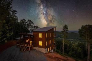 a cabin in the woods at night with the milky way at Big Sky - Best Views in Blue Ridge in Epworth +67 photos